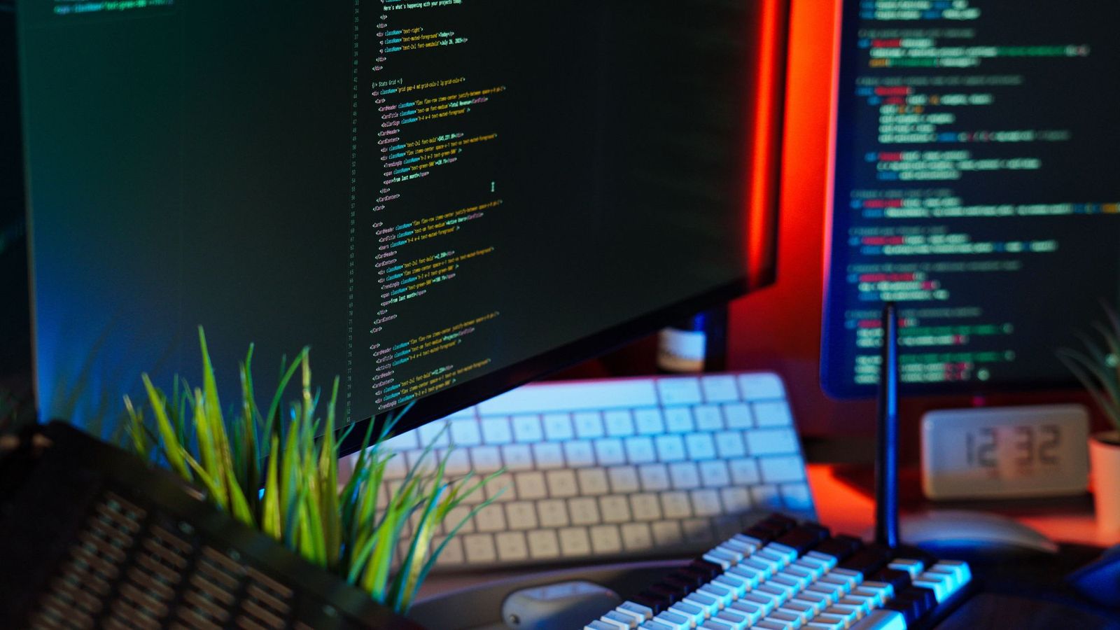 Web designer reviewing a website on dual monitors