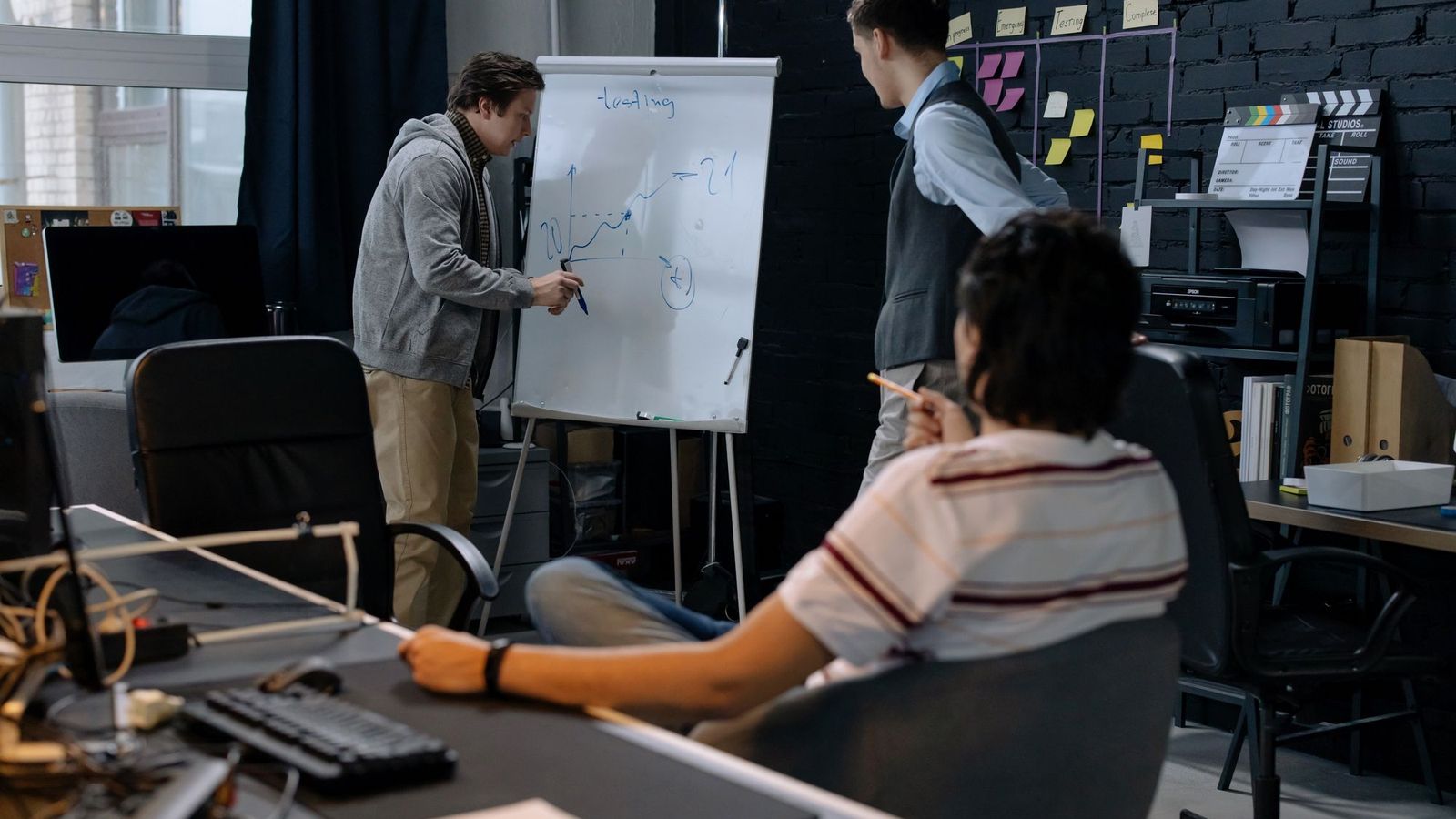 Founders planning a startup launch on a whiteboard — CBD and vape startup packages UK